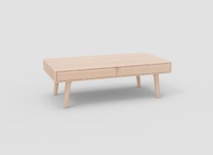 Een minimalistische, lichte houten salontafel met vier schuine poten en twee parallelle lades, tegen een effen witte achtergrond.