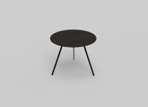 Een kleine, ronde zwarte tafel met dunne poten staat tegen een lichtgrijze achtergrond. De tafel heeft een minimalistisch design en een glad oppervlak.