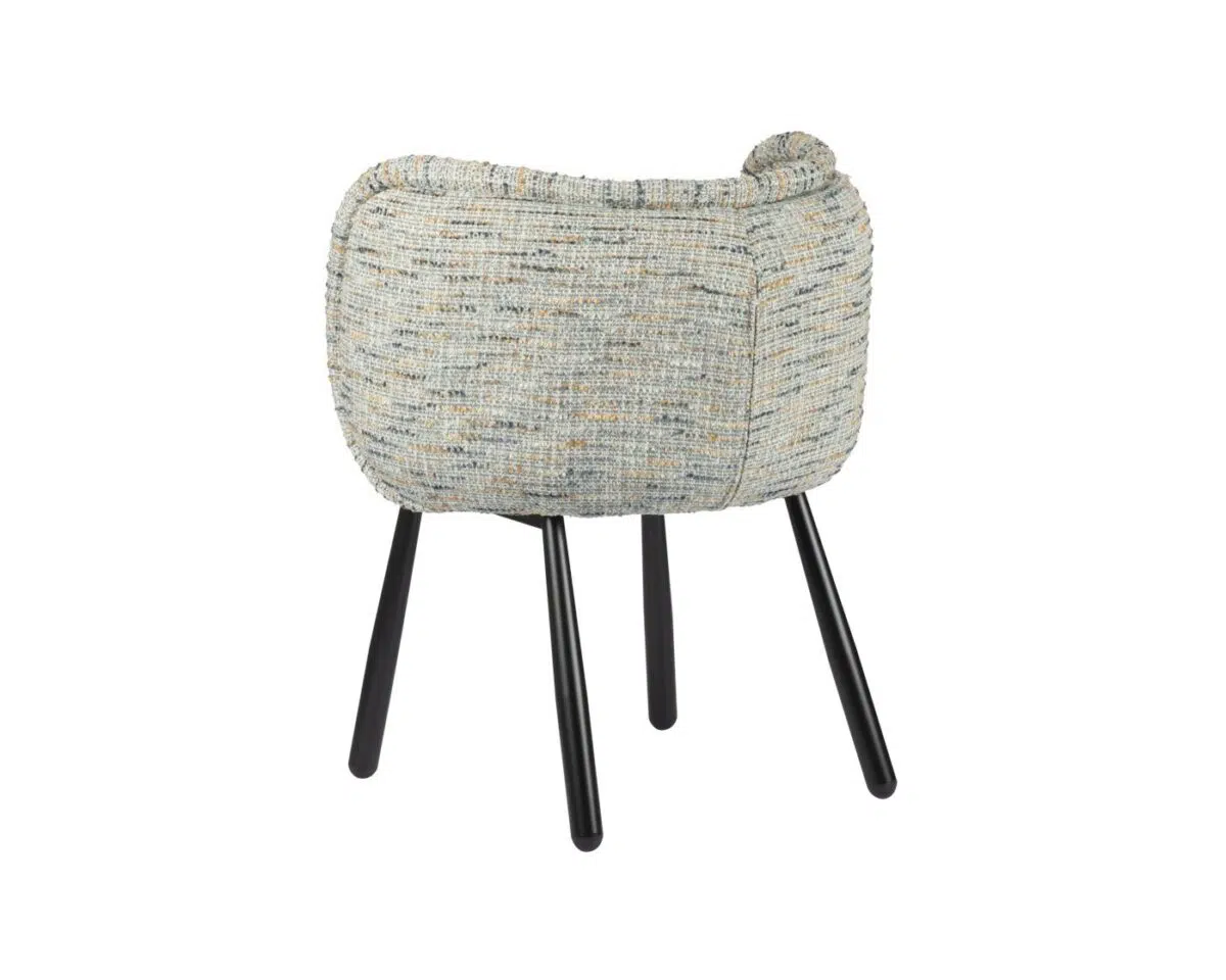 Een moderne kruk met een grijs, getextureerd kussen dat de zitting en rugleuning vormt. De kruk heeft een rond ontwerp en staat op vier slanke zwarte poten, wat een stijlvolle en eigentijdse look creëert.