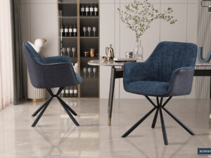 Twee SALE - Eetkamerstoel 'Lucie' Bouclé Blauw Vloerkleed PU Blauw stoelen (2 per doos) met zwart metalen poten staan in een stijlvolle eetkamer met een marmeren vloer, moderne tafel, planken met glazen en flessen en een vaas met takken.