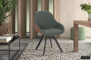 Een stijlvolle kamer met houten panelen, een tafel, planten en een neutrale inrichting is voorzien van de SALE - Stoel 'Jan' Stof Groen Vloerkleed PU Cognac (2 per doos) stoel. Het merk "Rousseau" verschijnt in de rechterbenedenhoek.