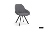 SALE - Stoel 'Jan' Stof Grijs Rug PU Donkergrijs (2 per doos): een moderne grijze stoel met een gebogen rugleuning, gestoffeerde zitting en vier schuine zwart metalen poten. Minimalistisch en stijlvol, ideaal voor thuis of op kantoor.