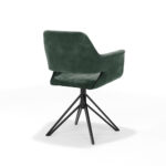 De Katy Eetkamerstoel - Aurora Velours Hunter heeft een groene bekleding, armleuningen en een zwart metalen draaivoet, schuin van achteren weergegeven op een witte achtergrond.