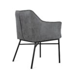 De Eetkamerstoel Boston Antraciet is een moderne grijs gestoffeerde fauteuil met een licht gebogen rugleuning, zwarte metalen poten en een minimalistisch ontwerp, van achteren en opzij tegen een witte achtergrond.