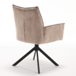De Eetkamerstoel Dani Velvet Beige is een moderne stoel met fluweelbeige bekleding, een hoge rugleuning en zwarte metalen spaakpoten, van achteren gezien op een witte achtergrond.