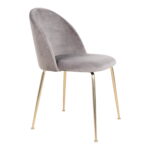 De Geneve Eetkamerstoel is een set van 2 moderne eetkamerstoelen in grijs fluweel met gebogen rugleuningen en slanke metalen poten in messinglook, die een eenvoudig maar elegant ontwerp bieden.