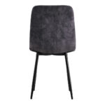 De Eetkamerstoel Yerevan Velvet Antraciet heeft een donkergrijze fluwelen beklede rugleuning en zitting, van achteren gezien, gecombineerd met slanke zwart metalen poten voor een moderne uitstraling.
