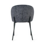 De Eetkamerstoel Lio - Antraciet is een modern gestoffeerde stoel met een ronde, grijze rugleuning met structuur en slanke zwarte metalen poten, van achteren gezien tegen een witte achtergrond.