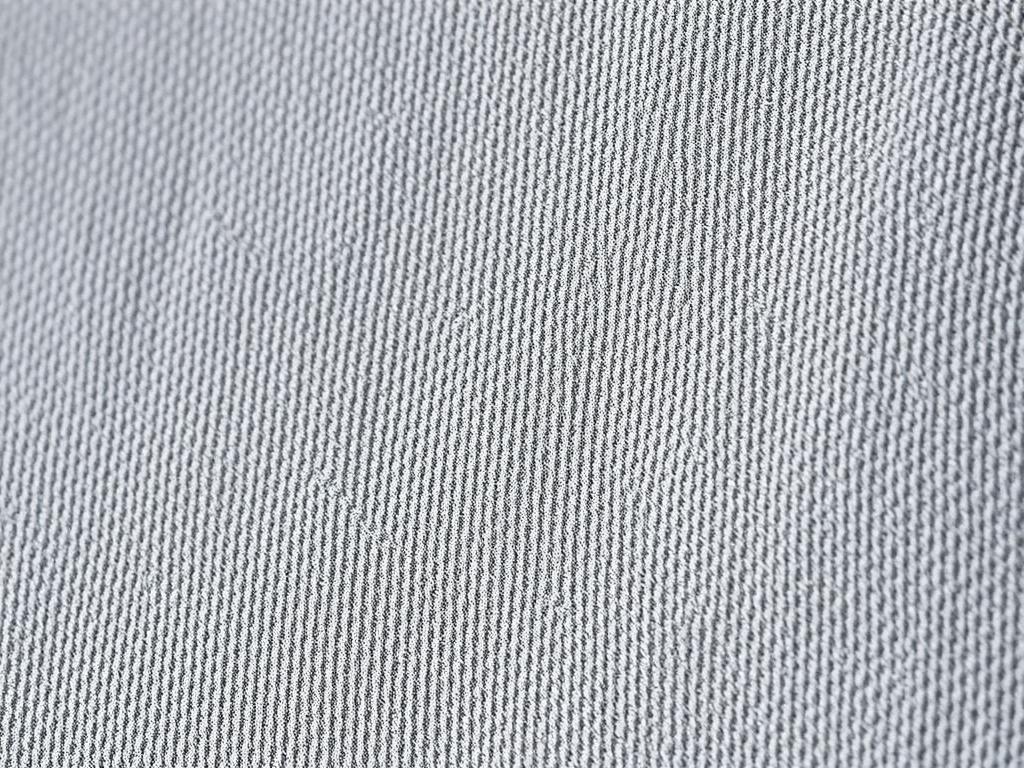 Close-up van microvezel stof voor eetkamerstoelen met zichtbare fijne textuur Close-up van microvezel stof voor eetkamerstoelen met zichtbare fijne textuur