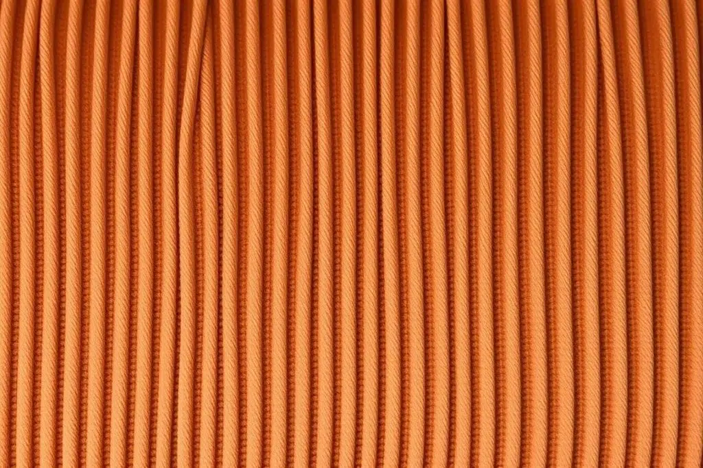 Close-up van ribstof voor eetkamerstoelen met zichtbare ribstructuur Close-up van ribstof voor eetkamerstoelen met zichtbare ribstructuur