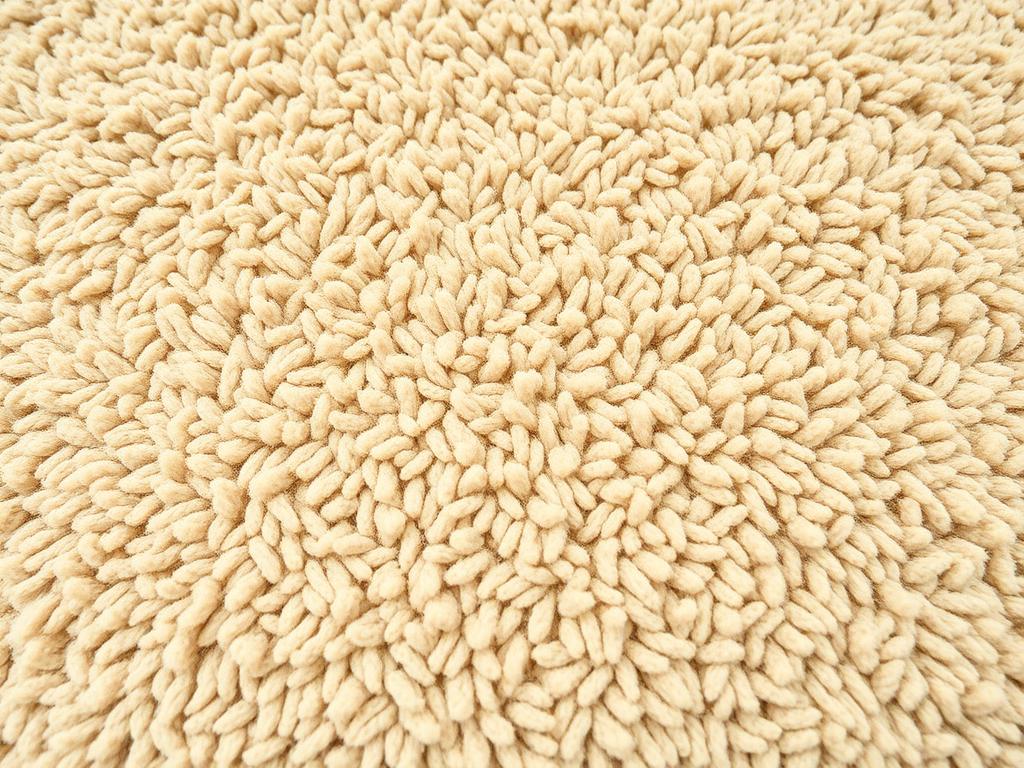 Teddy/borg stof als alternatief voor boucle, getoond in een warme beige tint met zichtbare zachte textuur Teddy/borg stof als alternatief voor boucle, getoond in een warme beige tint met zichtbare zachte textuur