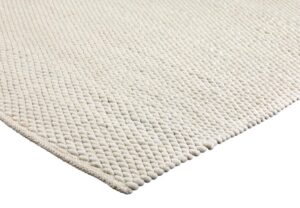 Close-up van het tapijt Donna Ivory 111 200x300, met een gestructureerd, gebroken wit geweven oppervlak met een kenmerkend kiezelachtig patroon en zichtbare hoekdetails.