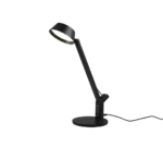 De TRIO Tafellamp Ava L is een moderne zwarte bureaulamp met een schuin verstelbare arm, een ronde voet met meerdere USB-poorten en straalt licht uit als hij aan staat.