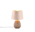 De REALITY Tafellamp ARIANA heeft een verlichte, getextureerde voet met patronen en een beige lampenkap. Een wit netsnoer komt uit de voet.