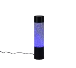 De REALITY Tafellamp GLITTER is een cilindervormige zwarte tafellamp met een helder glittergedeelte, blauwe verlichting en een netsnoer dat uit de voet steekt.
