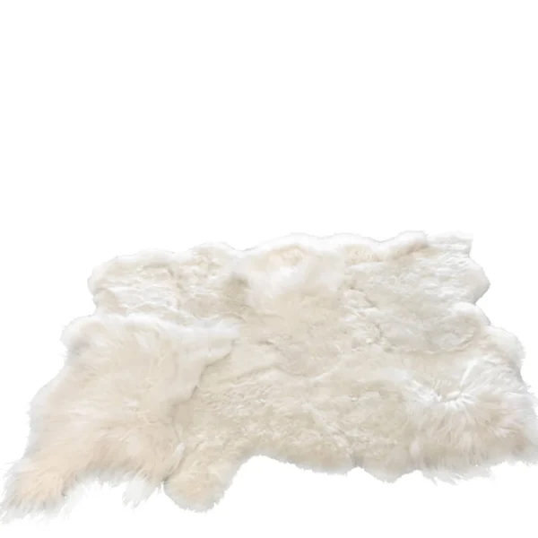 Het Vloerkleed Schaap Wit Klein, een zacht en donzig wit schapenvachtdeken, wordt weergegeven op een witte achtergrond. In de rechterbovenhoek staat een klein pictogram in de vorm van leer met de tekst "GENUINE LEATHER".