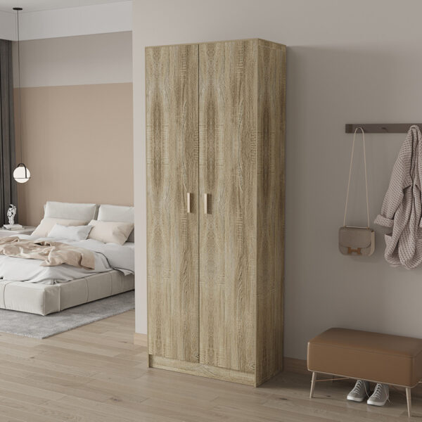Een moderne slaapkamer met een laag bed, SALE - Opbergkast 'Space' 2 deuren en 5 legplanken Sonoma (1c) houten kledingkast, wandhaken met jas en tas, een bank, groot raam met gordijnen, lichte houten vloeren en neutrale muren.