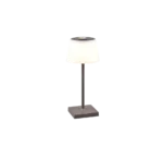 De Reality Tafellamp Sanchez is een moderne tafellamp met een slanke metalen voet, een slanke verticale steel en een witte, licht taps toelopende kap. Als de lamp aanstaat, straalt hij een zacht, sfeervol licht uit.