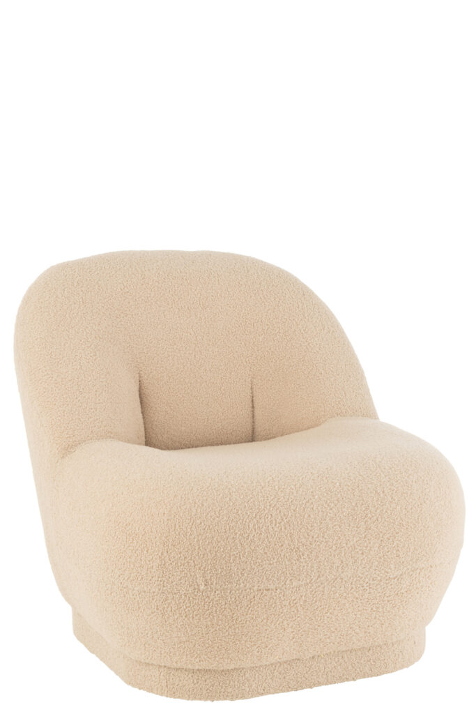 De Kruk Teddy Velvet Wit/Beige is een moderne, lage loungestoel bekleed met zacht crèmekleurig fluweel met een ronde, getufte rugleuning en zitting.
