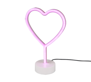 De REALITY Tafellamp HEART is een roze neon, hartvormige tafellamp op een witte ronde voet met een zwart netsnoer tegen een effen achtergrond.