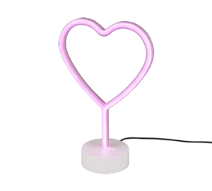 De REALITY Tafellamp HEART is een roze neon, hartvormige tafellamp op een witte ronde voet met een zwart netsnoer tegen een effen achtergrond.