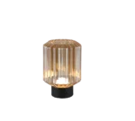 De REALITY Tafellamp LORD heeft een modern ontwerp met een cilindrische geribbelde glazen kap, zwarte ronde voet en straalt een warm licht uit.