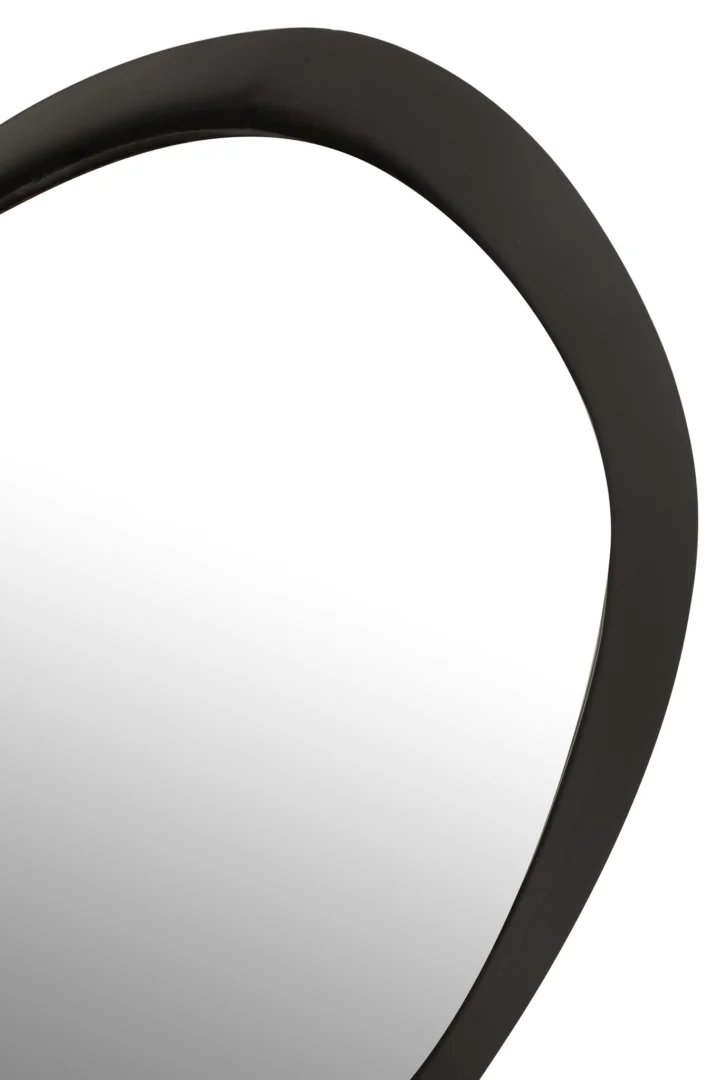 Close-up van het bovenste deel van de Wandspiegel Rond Metaal/Glas Zwart Klein, met het asymmetrische ontwerp, de dikke donkere afgeronde lijst en een reflecterend oppervlak dat subtiel opgaat in de achtergrond.