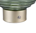 Een close-up van de metalen voet van de REALITY Tafellamp EARL met een rond glazen blad, waarop een kleine zilveren knop op het metalen oppervlak zichtbaar is.