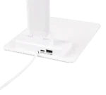Close-up van de basis van de TRIO Tafellamp Travis, met een USB-poort, aan/uit-knop en oplaadkabel. Het strakke, minimale ontwerp draagt bij aan de moderne uitstraling.