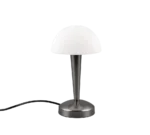 De REALITY Tafellamp CANARIA heeft een metalen voet, een slanke kegelvormige standaard, een koepelvormige witte lampenkap en een zwart snoer dat uit de voet steekt voor een moderne look.