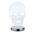 De REALITY Tafellamp SKULL is een rechtopstaande, transparante 3D wireframe menselijke schedel op een ronde metalen voet, die lijkt op een moderne decoratieve lamp of kunstwerk.
