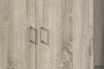 Close-up van Opbergkast 'Ray' 2 deuren en 4 legplanken Sonoma (1c) met twee deuren met lichte houtnerf, metalen handgrepen en een zichtbaar "ROUSSEAU" label rechtsonder. Houtstructuur en schaduwen van handgrepen zijn duidelijk.