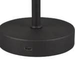 Close-up van de ronde zwarte voet van de REALITY Tafellamp JEFF met een zichtbare USB-C poort aan de zijkant en de lampvoet die vanuit het midden omhoog steekt.