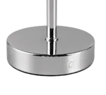 Close-up van de glanzende, ronde metalen voet van de REALITY Tafellamp JEFF met een kleine ronde knop aan de zijkant en een verticale paal die uit het midden steekt.