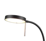 De TRIO Tafellamp Monza is een moderne zwarte bureaulamp met een ronde, platte lampkop en een flexibele, geribbelde hals, verlicht en naar beneden gericht.