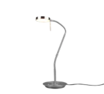 De TRIO Tafellamp Monza is een moderne metalen bureaulamp met een ronde voet, een slanke gebogen hals en een ronde kop voor verlichting, met een netsnoer dat uit de voet steekt.