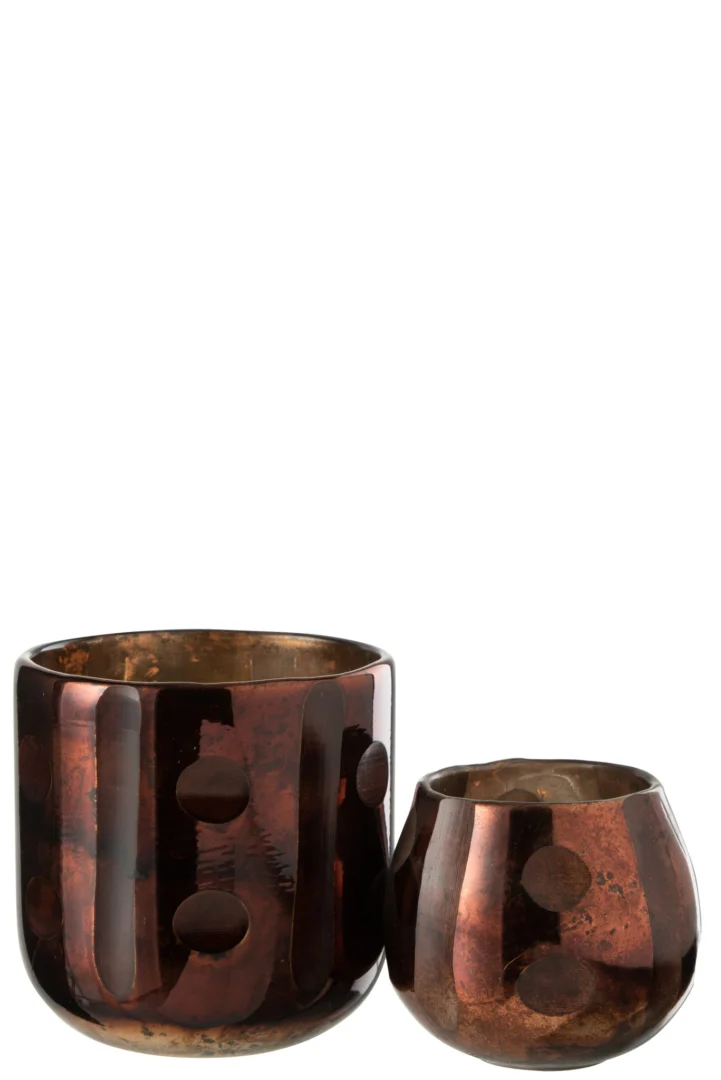 Twee ronde, bruine "Theelichthouder Kokosnoot Cilinder Glas Bruin" glazen vazen hebben een glanzende afwerking, verhoogde stippenpatronen en een metallic glans. De grootste is cilindervormig, terwijl de kleinere korter en ronder is.