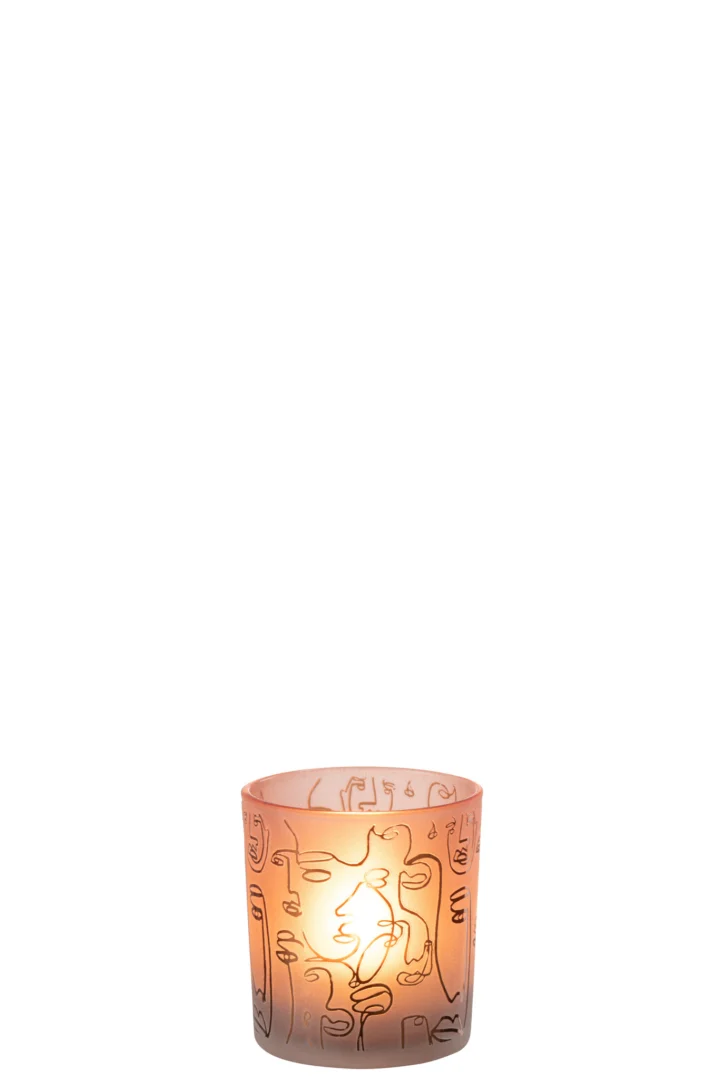 Theelichthouder Happy Faces Glas Terracotta Klein is een brandende kaars in een doorschijnende roze glazen houder met abstracte zwarte lijntekeningen, gecentreerd op een witte achtergrond.