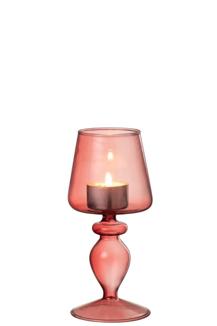 De Kaarsenhouder Glas Roze Framboos Klein is een kleine, roze glazen kandelaar met een elegante gebogen steel en een brede, ronde kom. Het doorschijnende glas gloeit zacht wanneer er een waxinelichtje in brandt.