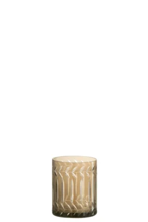 De Theelichthouder Twijg Glas Rookgrijs is een korte, transparante glazen houder met een geometrisch, geëtst patroon op het oppervlak tegen een effen witte achtergrond.