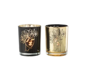 Set van twee Kaarsenhouder Orkaan Dame Bloemen glazen kandelaars - één zwart met goud omlijnd abstract vrouwengezicht en bloemmotief, en één goud met hetzelfde motief omlijnd in zwart. Middelgroot formaat.