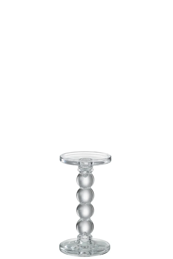 De Kaarsenhouder Druppels Glas Transparant Medium is een kaarsenhouder van helder glas met een ronde basis, een ronde bovenkant en een steel gevormd door vier gestapelde glazen bollen voor een eenvoudige, minimalistische look.