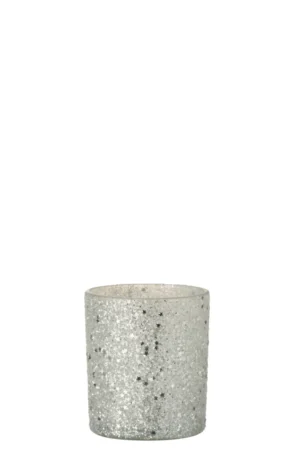 Theelichthouder Sterren Glas Zilver is een kleine, cilindervormige glazen kandelaar met een zilveren glitterafwerking, afgebeeld tegen een effen witte achtergrond.