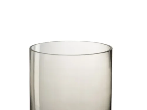 De Kaarsenhouder Orkaan Glas Beige Rond is een heldere, ronde glazen kandelaar met rechte zijden en een dikke basis, tegen een effen witte achtergrond.