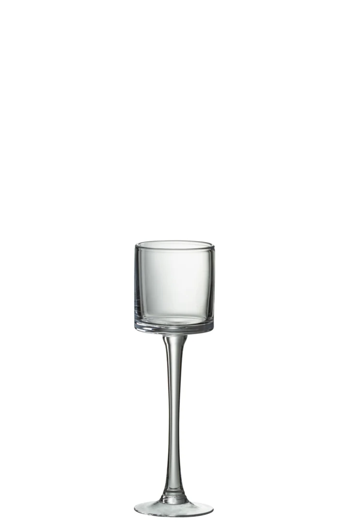 De Kaarsenhouder Op Voet Cilinder Glas Transparant Klein, een kleine kaarsenhouder van transparant glas met een cilindrische kom en hoge steel, is gecentreerd op een witte achtergrond.