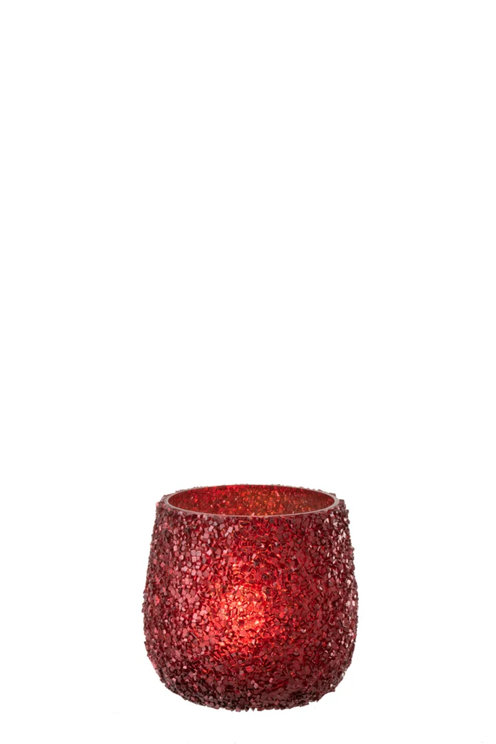 Theelichthouder Glitter Glas Rood: een kleine, ronde kandelaar van rood glas met een kralenstructuur en een brandende kaars erin, afgebeeld tegen een effen witte achtergrond.