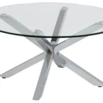 De Salontafel Transparant 82 CM Rond is een ronde salontafel van transparant kunststof met een modern, kruisend pootstel in een zilveren afwerking.