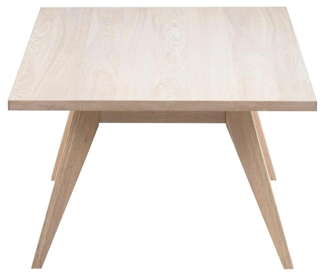 De Salontafel Roest, Wit (70 x 45 cm) is een rechthoekige tafel van eikenfineer, die vanaf de kopse kant wordt getoond om het moderne minimalistische ontwerp en de natuurlijke houtnerf te benadrukken.