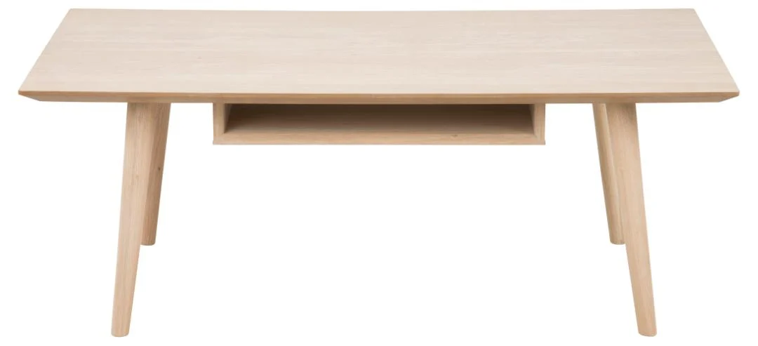 De Salontafel Wit is een ronde tafel (60 x 42 cm) gemaakt van eikenfineer, met vier schuine poten en een kleine open plank onder het tafelblad, afgebeeld vanaf de voorkant.