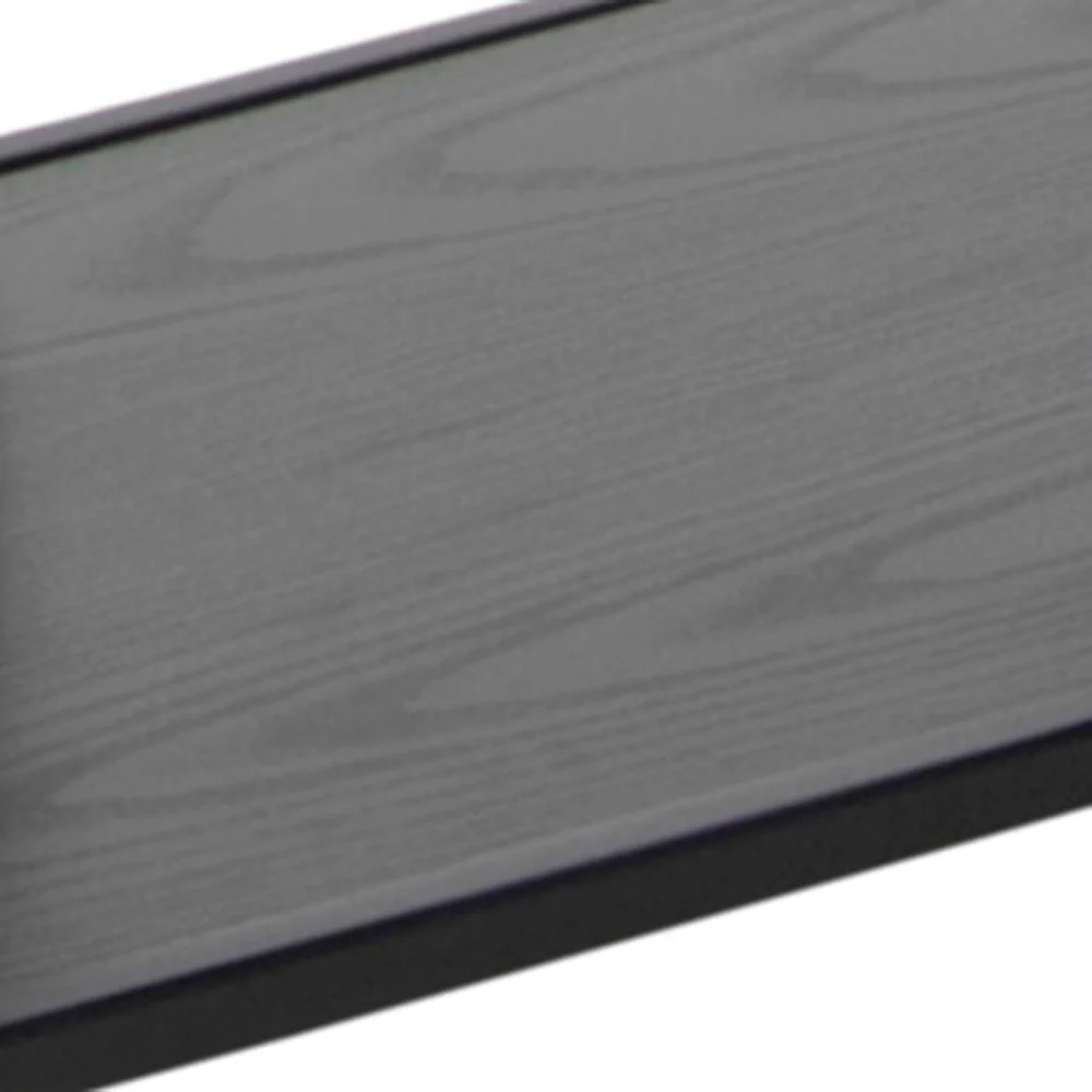 Een close-up van de Seaford boekenkast toont het rechthoekige, donkergrijze houten oppervlak met zichtbare houtnerfstructuur en een licht opstaande rand.